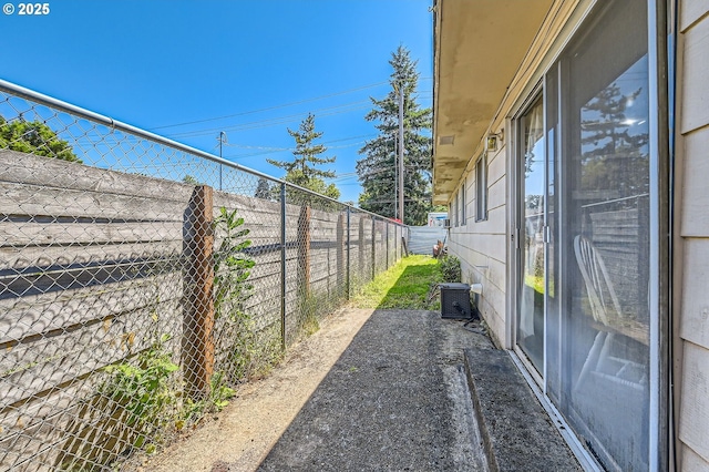 6135 SE Clatsop St, Portland, OR 97206 - view of side of home with a fenced backyard and a patio area