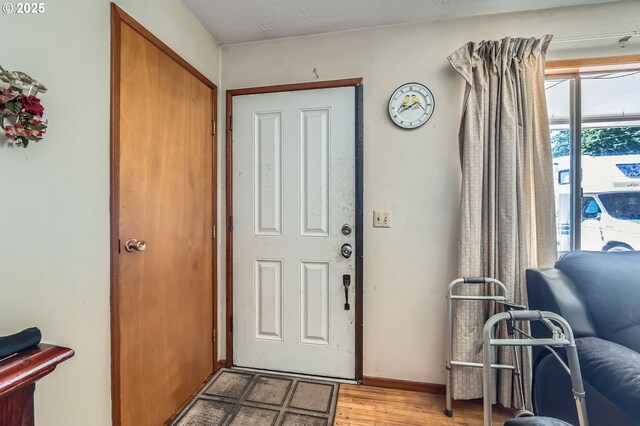 6135 SE Clatsop St, Portland, OR 97206 - entrance foyer with light wood-style flooring and baseboards