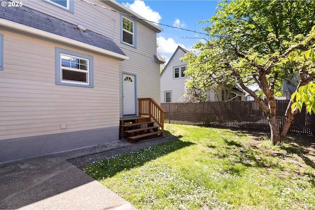 back of property featuring a shingled roof