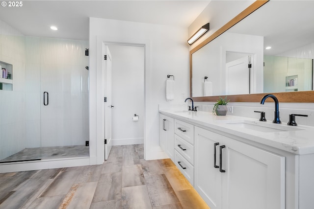 bathroom with vanity and an enclosed shower