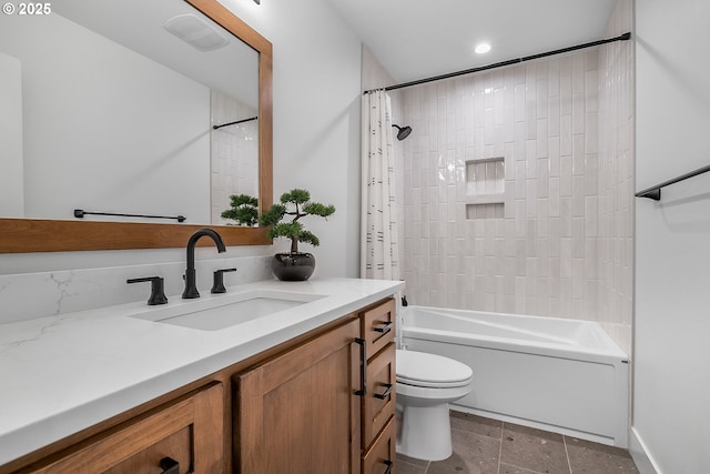 full bathroom with vanity, shower / tub combo, and toilet