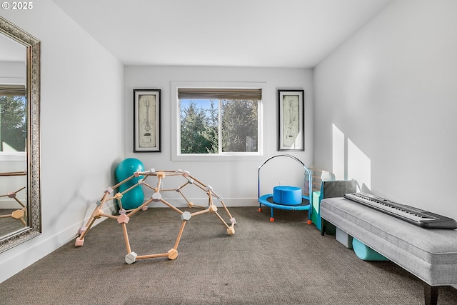 recreation room featuring a wealth of natural light and carpet flooring