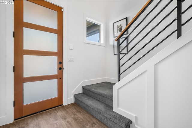 entryway with hardwood / wood-style floors