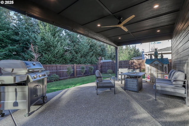 view of patio / terrace featuring ceiling fan and an outdoor fire pit