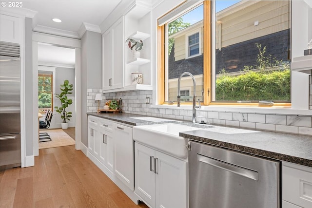 4015 NE 38th Ave, Portland, OR 97212 - kitchen featuring stainless steel appliances, crown molding, open shelves, light wood finished floors, and white cabinetry