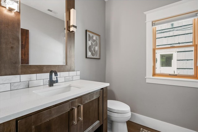 4015 NE 38th Ave, Portland, OR 97212 - bathroom featuring vanity, tasteful backsplash, and wood finished floors