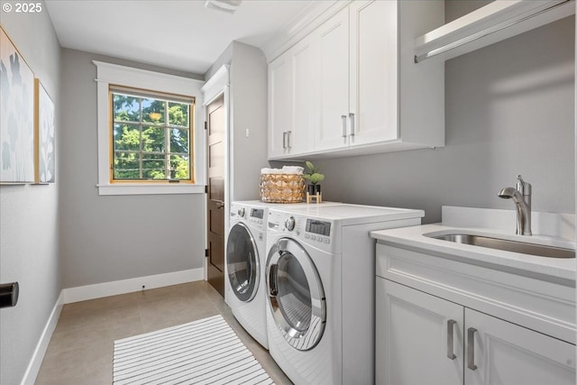 4015 NE 38th Ave, Portland, OR 97212 - laundry room with cabinet space, washing machine and dryer, and light tile patterned flooring