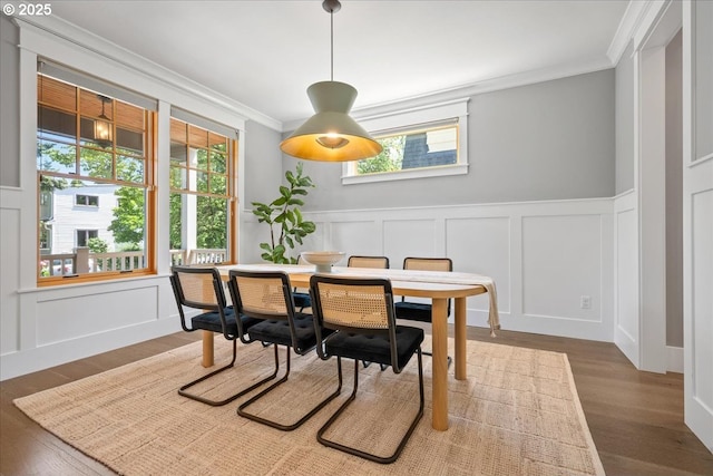 4015 NE 38th Ave, Portland, OR 97212 - dining space featuring a decorative wall, ornamental molding, wood finished floors, and wainscoting