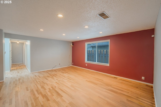 446 44th Ave, Salem, OR 97317 - empty room featuring light wood-style flooring, recessed lighting, baseboards, and a textured ceiling