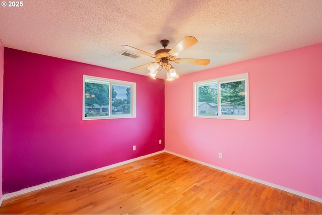 446 44th Ave, Salem, OR 97317 - unfurnished room featuring light wood-type flooring, a textured ceiling, ceiling fan, and baseboards