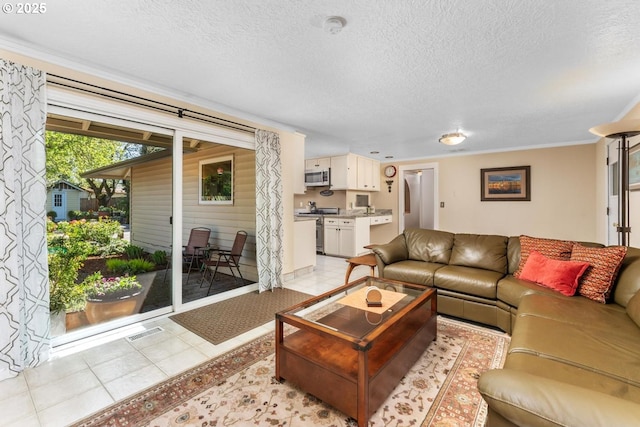 living area with crown molding, a textured ceiling, and light tile patterned floors