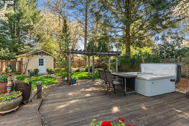 wooden deck with an outbuilding, fence, a pergola, and outdoor dry bar