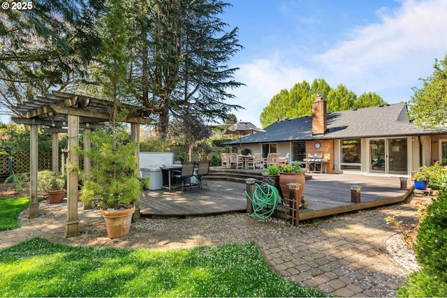 view of patio / terrace featuring a wooden deck, a pergola, grilling area, and outdoor dining space
