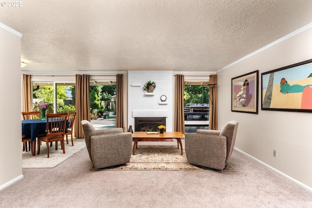 carpeted living area featuring crown molding, a textured ceiling, baseboards, and a fireplace