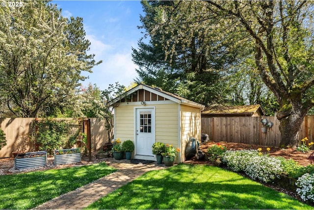 view of shed with a fenced backyard