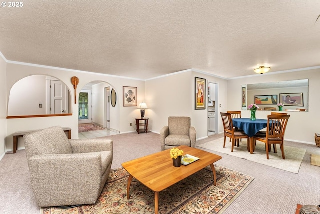 living area with light colored carpet, arched walkways, baseboards, and crown molding