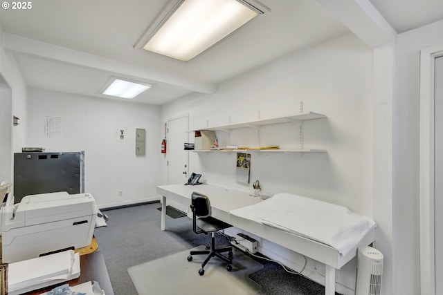 office space featuring beamed ceiling, dark carpet, and baseboards