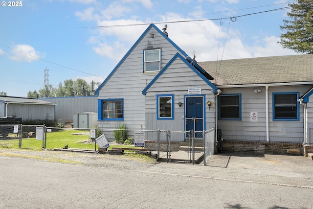 8935 SE Stanley Pl, Portland, OR 97206 - bungalow-style house featuring a fenced front yard and a gate