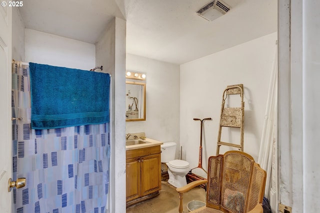 bathroom with curtained shower, toilet, concrete floors, vanity, and visible vents