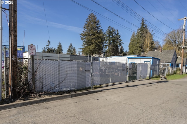 view of gate with fence