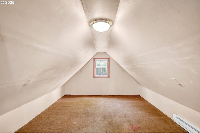 8935 SE Stanley Pl, Portland, OR 97206 - bonus room featuring a baseboard heating unit, lofted ceiling, and carpet