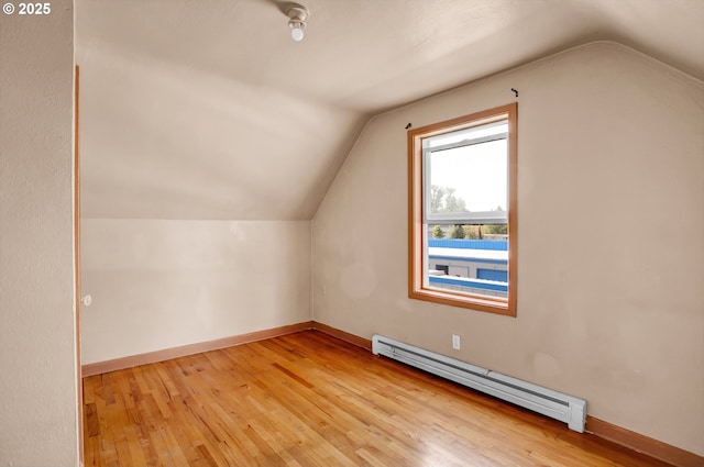 8935 SE Stanley Pl, Portland, OR 97206 - additional living space with light wood-type flooring, baseboards, lofted ceiling, and baseboard heating