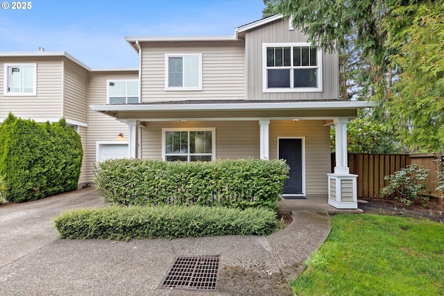 view of front of property with a porch and a garage