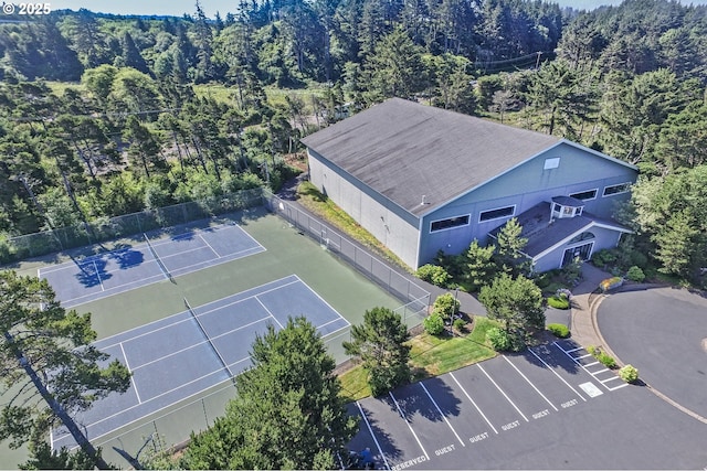 5952 SW Cupola Dr, South Beach, OR 97366 - birds eye view of property with a wooded view