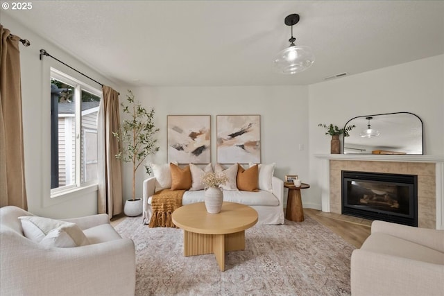 15314 NE 88th St, Vancouver, WA 98682 - living room featuring wood finished floors and a tiled fireplace