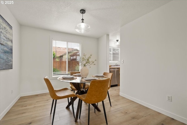 15314 NE 88th St, Vancouver, WA 98682 - dining space with light wood finished floors and a textured ceiling