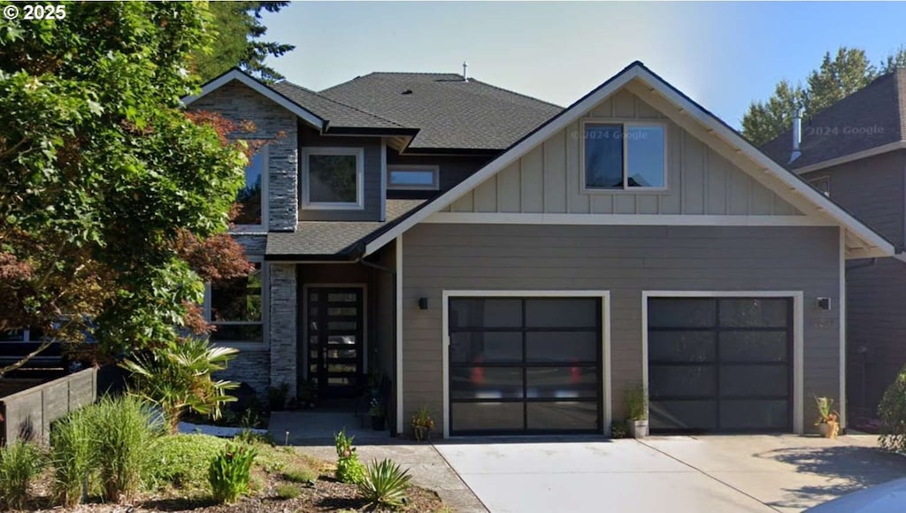 view of front of house with board and batten siding and driveway