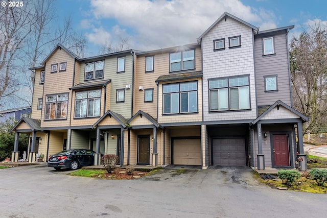 view of property with driveway and a garage