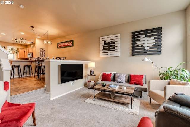 carpeted living area with baseboards