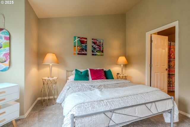 bedroom with carpet flooring and baseboards