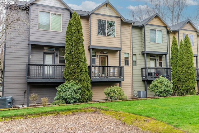 exterior space featuring a front lawn and central air condition unit