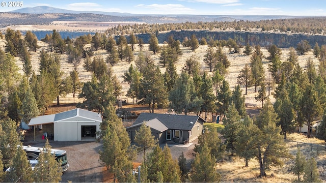 aerial view with a forest view and a mountain view