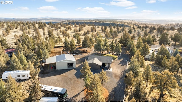 aerial view featuring a wooded view