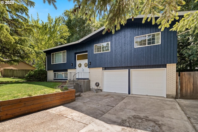 14370 SW Wilson Dr, Beaverton, OR 97008 - bi-level home featuring brick siding, a garage, and concrete driveway