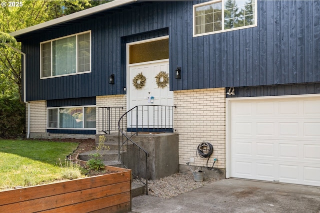 14370 SW Wilson Dr, Beaverton, OR 97008 - view of front facade featuring brick siding, a garage, and a front yard