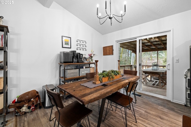 14370 SW Wilson Dr, Beaverton, OR 97008 - dining room with vaulted ceiling, wood finished floors, a chandelier, and baseboards