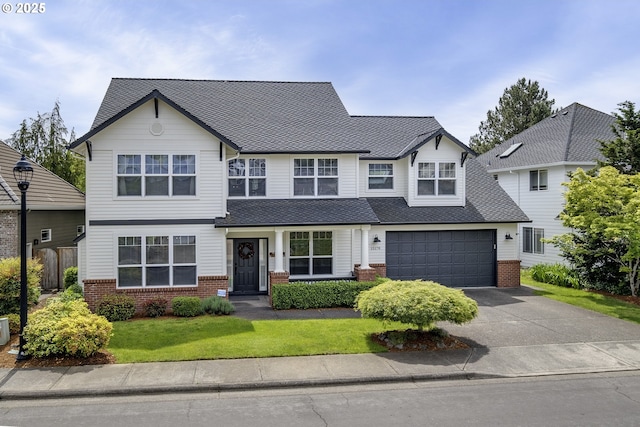 15178 NW Channa Dr, Portland, OR 97229 - view of front of home with brick siding, driveway, and roof with shingles