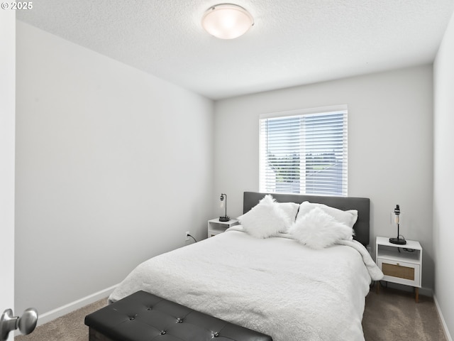 2421 S Trail View Ct, Ridgefield, WA 98642 - carpeted bedroom featuring baseboards and a textured ceiling