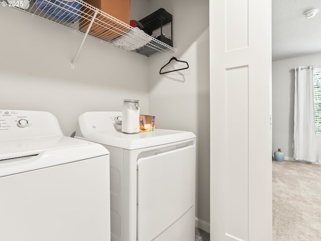 2421 S Trail View Ct, Ridgefield, WA 98642 - clothes washing area featuring carpet, baseboards, laundry area, and washing machine and clothes dryer