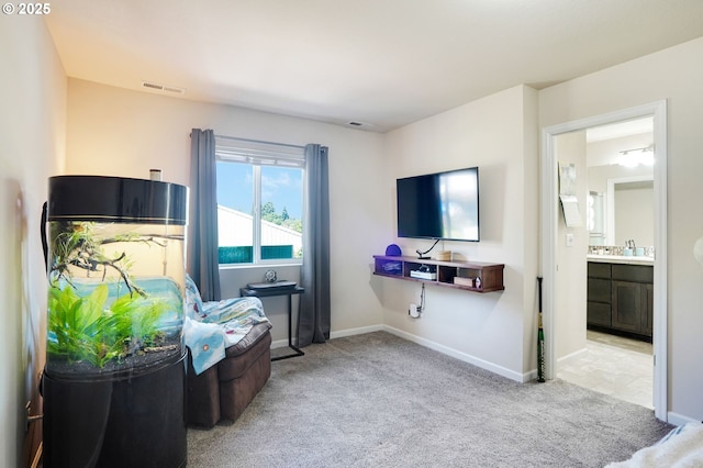 sitting room featuring baseboards, carpet, and visible vents