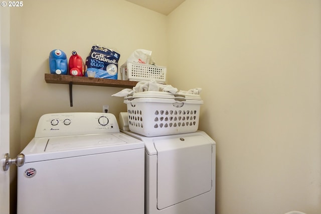 laundry room with separate washer and dryer and laundry area