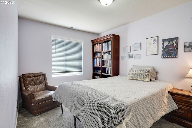 bedroom featuring visible vents and carpet flooring