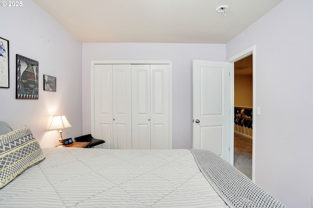 bedroom with a closet and carpet flooring