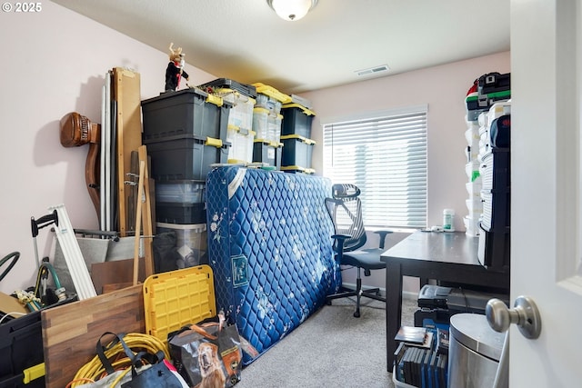 carpeted home office featuring visible vents