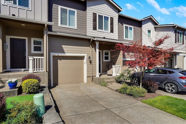 view of property featuring a garage, board and batten siding, and concrete driveway