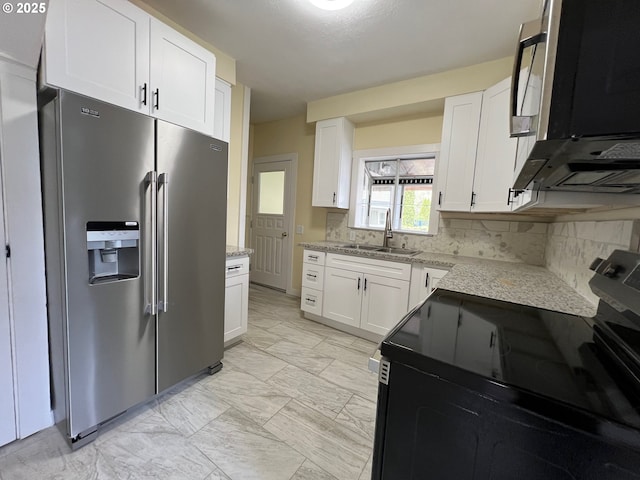 kitchen with stainless steel fridge with ice dispenser, white cabinetry, marble finish floor, a sink, and electric range oven